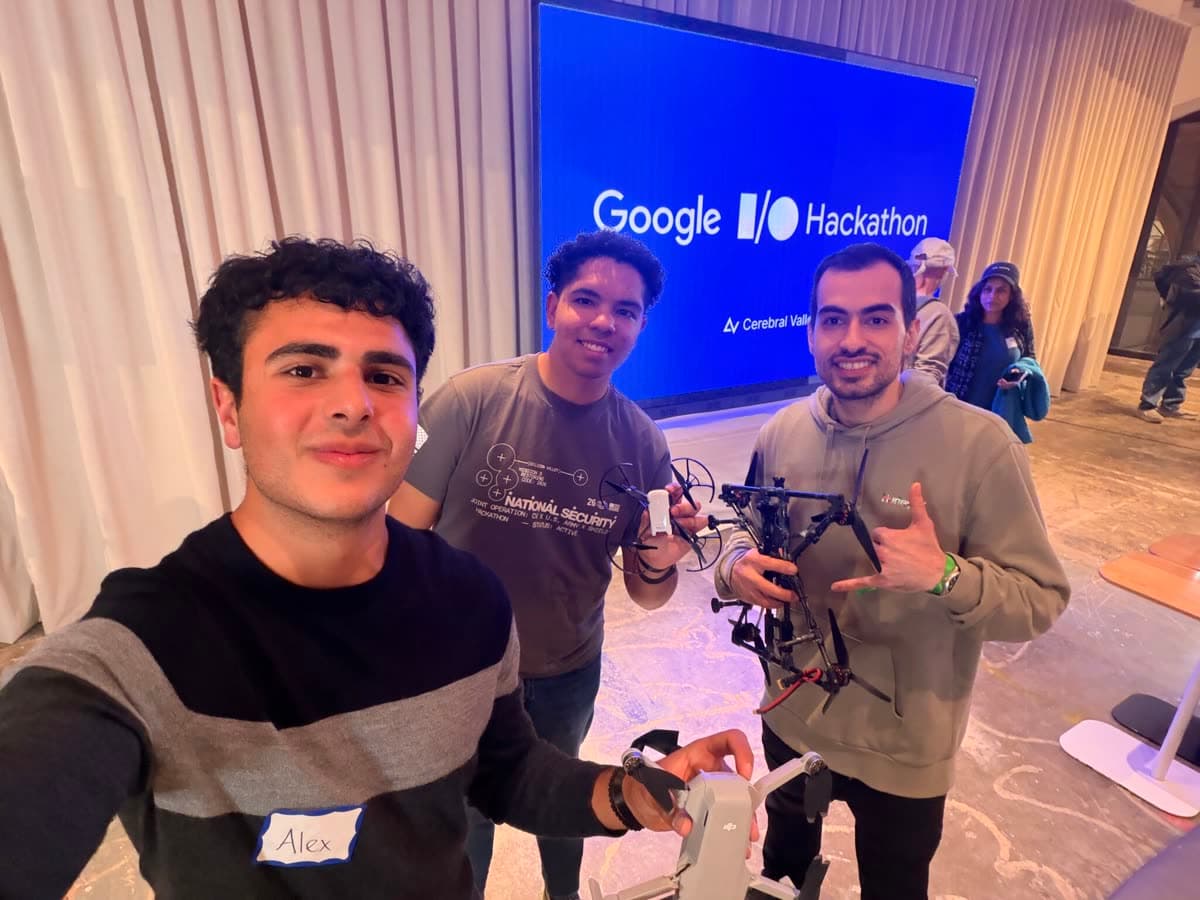 Alex and Nicolas at a hackathon, with a drone.